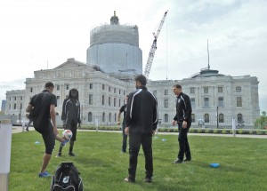 Minnesota United players juggle the ball in the shadow of the State Capital. Photo by Brian Quarstad.