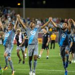 Minnesota United players celebrating after a match at TCF Bank Stadium